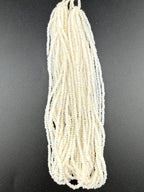 11/0 Sheen Chartlotte 2-Cut Patina White Opal AB