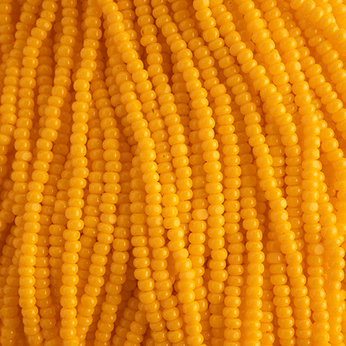 Czech Seed Beads 11/0 Cut Opaque Light Orange Strung Hank