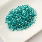 Cylin Bead 11/0 25g Bag Transparent Teal Caribbean AB