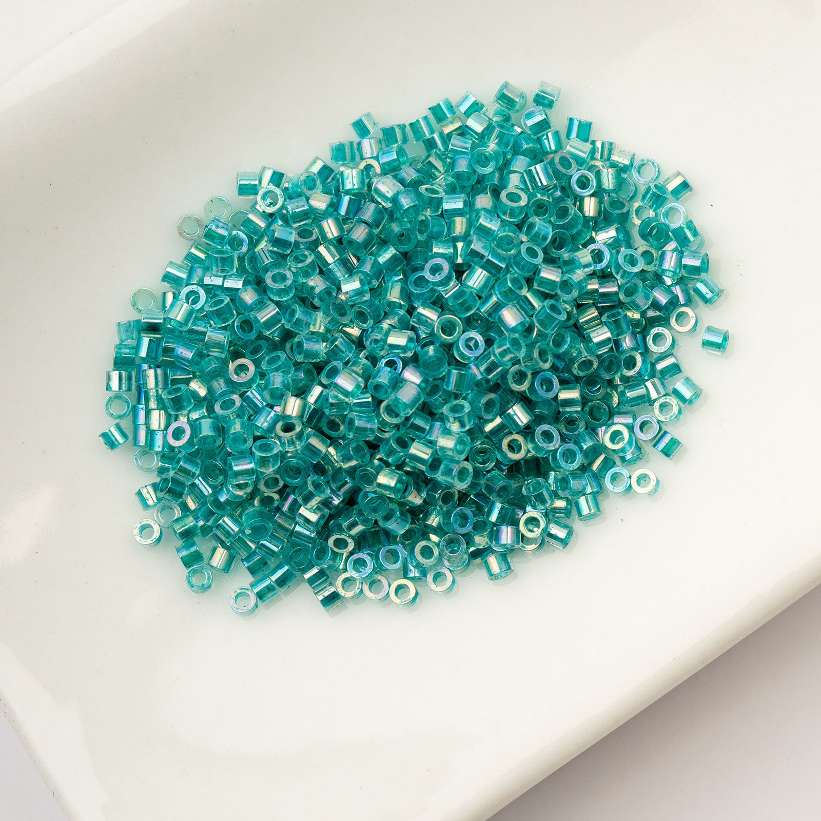 Cylin Bead 11/0 25g Bag Transparent Teal Caribbean AB