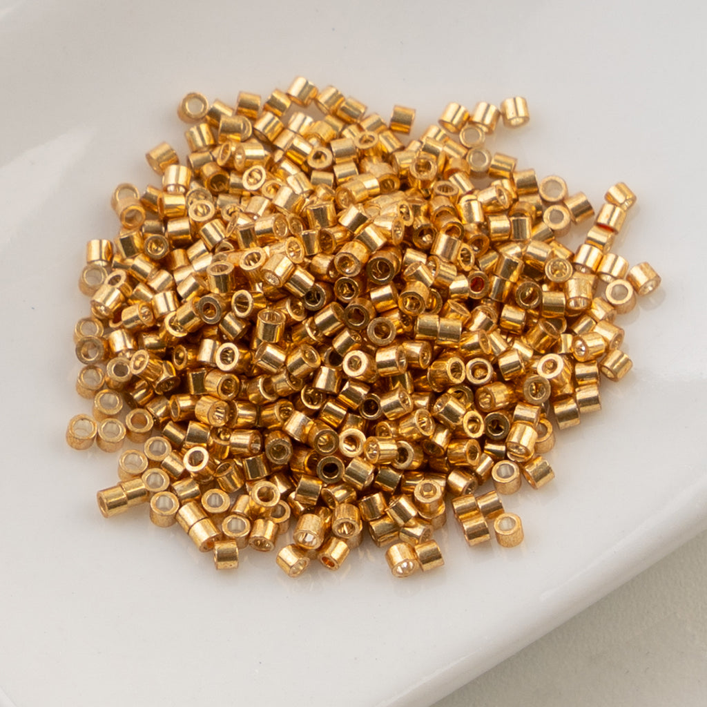 Cylin Bead 11/0 25g Bag Golden Alloy Glow